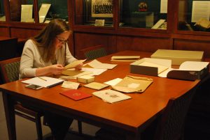 Peirs Project Intern, Meghan O'Donnell '18, examines additions to the Peirs Papers in Special Collections & College Archives, Musselman Library, 2017.