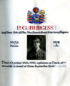 page from WWI book of remembrance featuring photo of P.G. Burgess and symbols of The Queen's (Royal West Surrey Regiment)