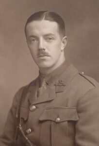 Sepia toned photograph of British WWI officer with moustache