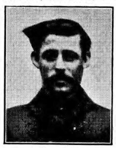 Black and white printed image of WWI soldier with moustache